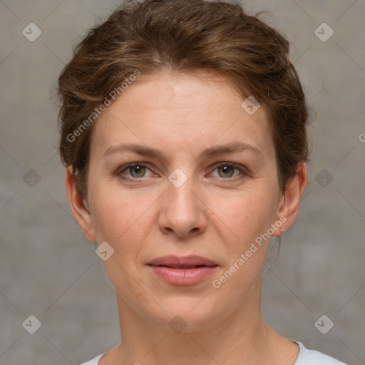 Joyful white adult female with short  brown hair and grey eyes