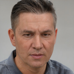 Neutral white middle-aged male with short  brown hair and brown eyes