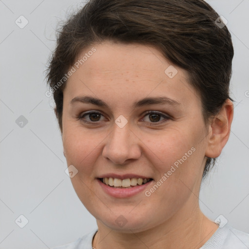 Joyful white young-adult female with short  brown hair and brown eyes