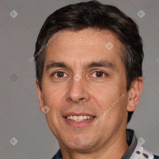 Joyful white adult male with short  brown hair and brown eyes