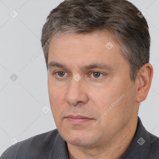 Neutral white adult male with short  brown hair and brown eyes