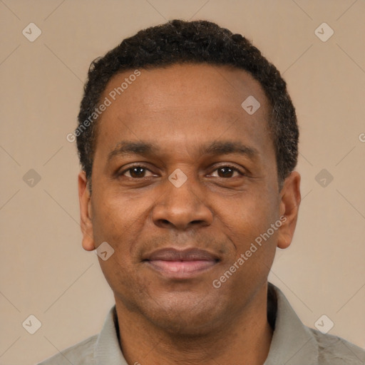 Joyful latino adult male with short  black hair and brown eyes