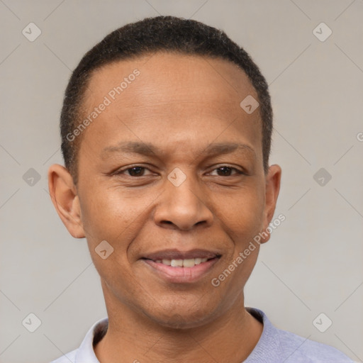 Joyful black adult male with short  brown hair and brown eyes