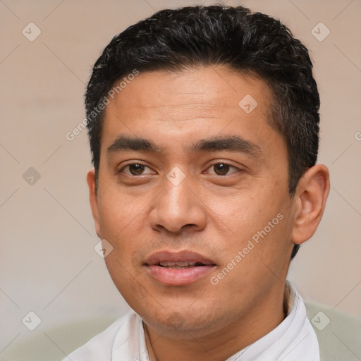 Joyful white young-adult male with short  black hair and brown eyes