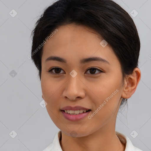 Joyful asian young-adult female with short  brown hair and brown eyes