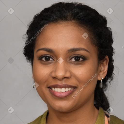 Joyful black young-adult female with short  brown hair and brown eyes