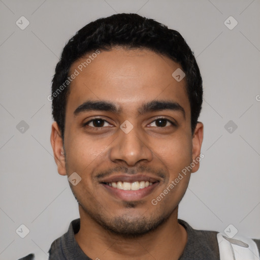 Joyful latino young-adult male with short  black hair and brown eyes