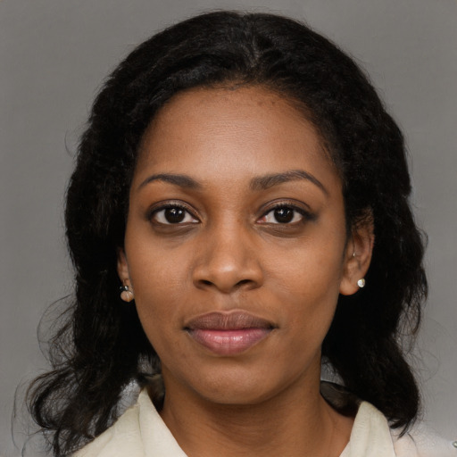Joyful black young-adult female with medium  black hair and brown eyes