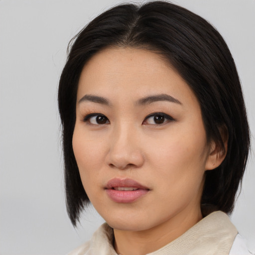 Neutral asian young-adult female with medium  black hair and brown eyes