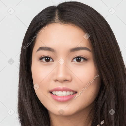 Joyful asian young-adult female with long  black hair and brown eyes