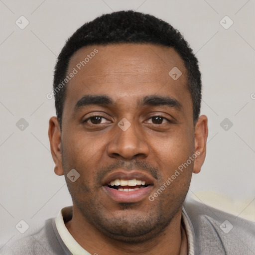 Joyful black young-adult male with short  black hair and brown eyes