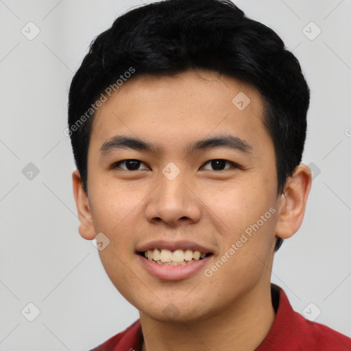 Joyful asian young-adult male with short  black hair and brown eyes