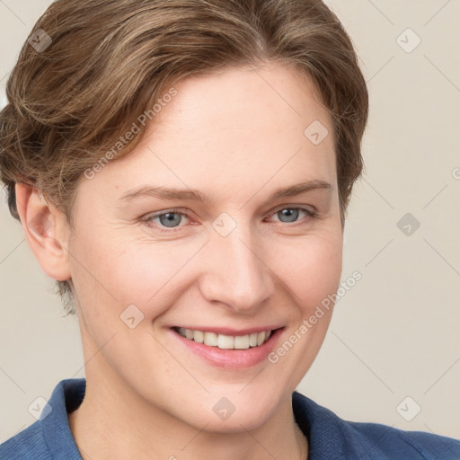 Joyful white young-adult female with medium  brown hair and blue eyes