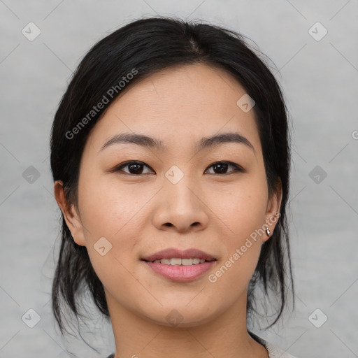 Joyful asian young-adult female with medium  black hair and brown eyes