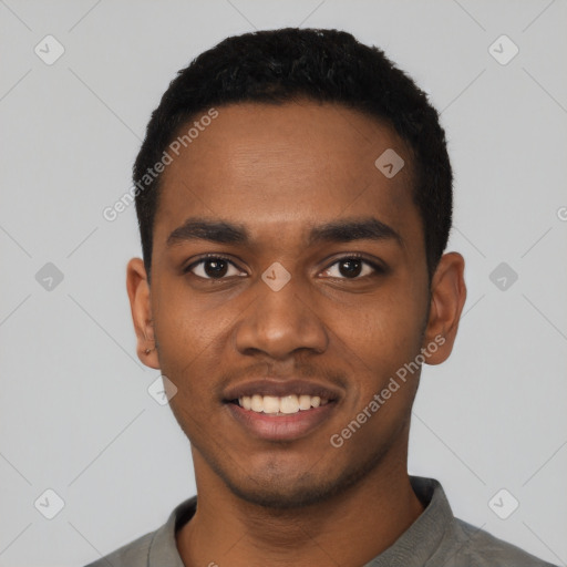 Joyful black young-adult male with short  black hair and brown eyes