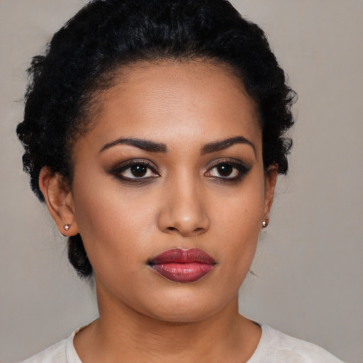 Neutral latino young-adult female with medium  black hair and brown eyes