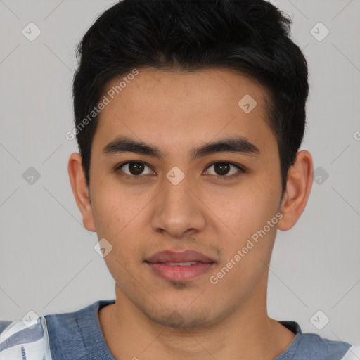 Joyful asian young-adult male with short  black hair and brown eyes