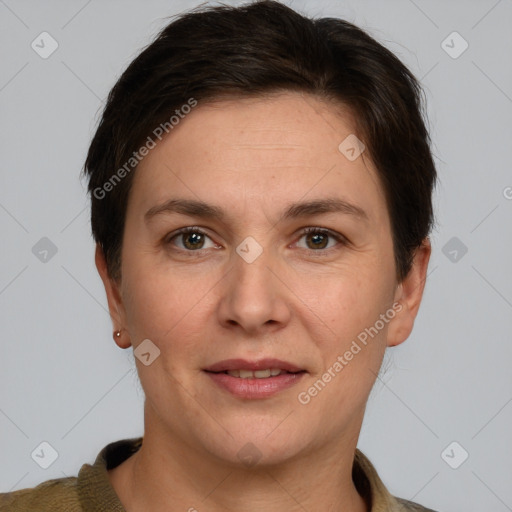 Joyful white adult female with short  brown hair and grey eyes