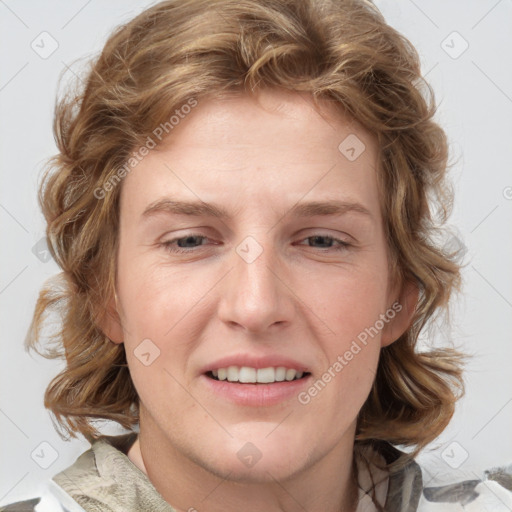 Joyful white young-adult female with medium  brown hair and blue eyes