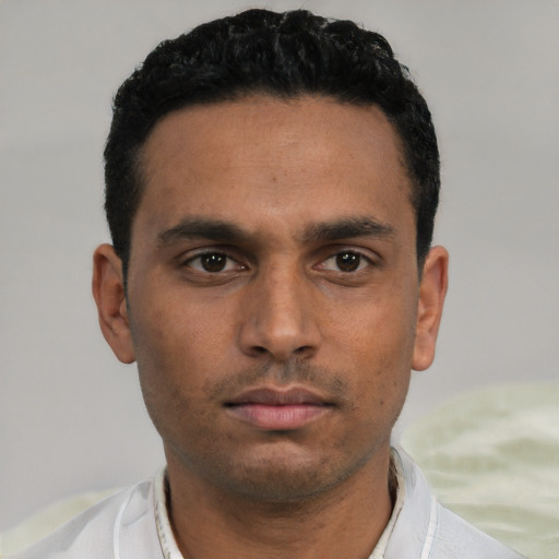 Neutral white young-adult male with short  black hair and brown eyes