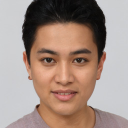 Joyful asian young-adult male with short  brown hair and brown eyes