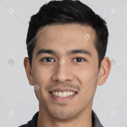 Joyful white young-adult male with short  black hair and brown eyes