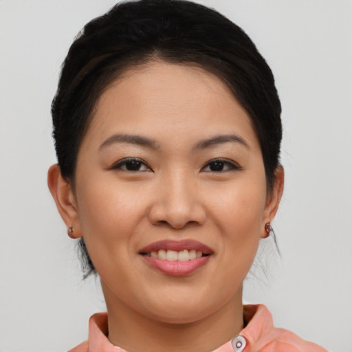 Joyful white young-adult female with medium  brown hair and brown eyes