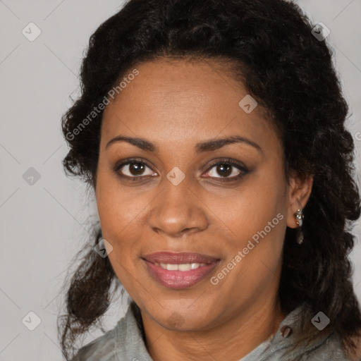 Joyful black adult female with medium  brown hair and brown eyes