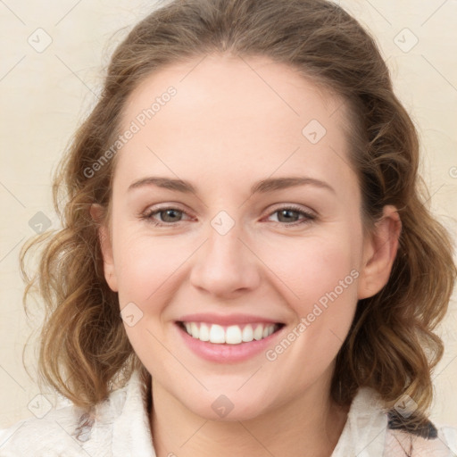 Joyful white young-adult female with medium  brown hair and green eyes