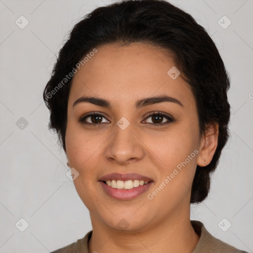 Joyful latino young-adult female with medium  brown hair and brown eyes