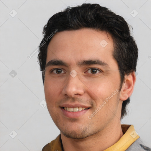 Joyful white young-adult male with short  black hair and brown eyes