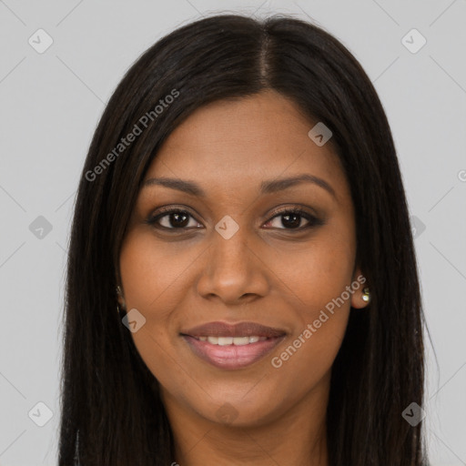 Joyful black young-adult female with long  brown hair and brown eyes