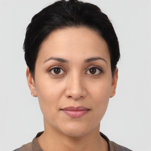 Joyful white young-adult female with short  black hair and brown eyes