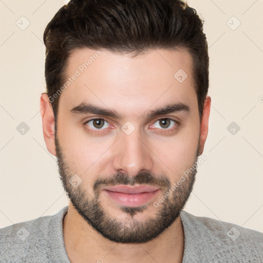 Joyful white young-adult male with short  black hair and brown eyes