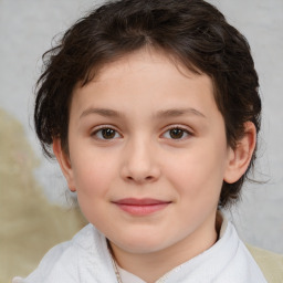 Joyful white child female with medium  brown hair and brown eyes