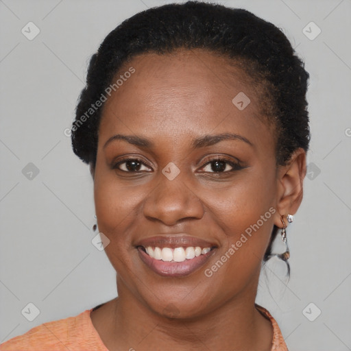 Joyful black young-adult female with short  brown hair and brown eyes