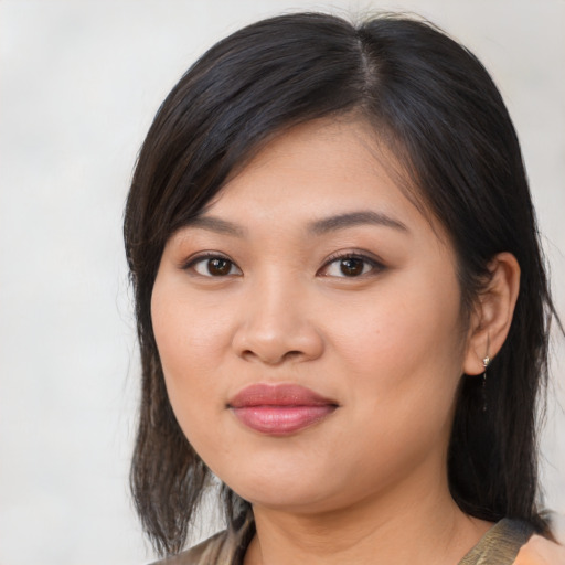 Joyful asian young-adult female with medium  brown hair and brown eyes
