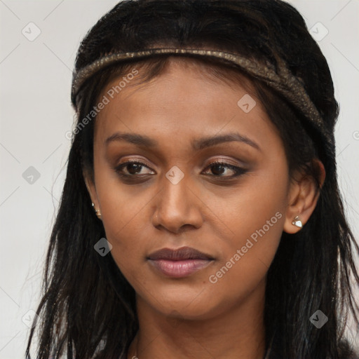 Joyful latino young-adult female with long  brown hair and brown eyes