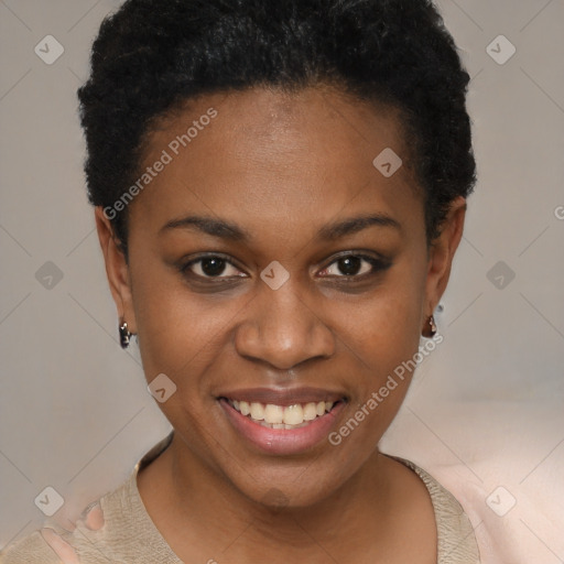 Joyful black young-adult female with short  brown hair and brown eyes