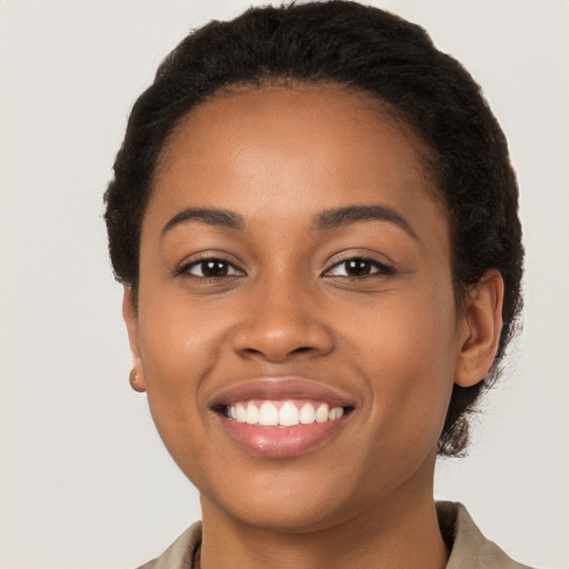 Joyful latino young-adult female with short  brown hair and brown eyes