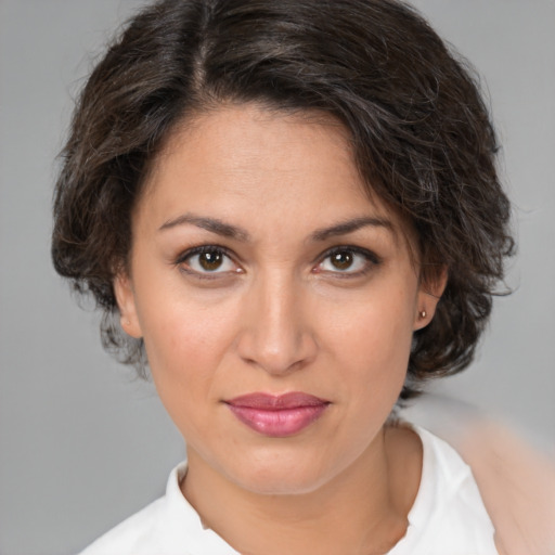 Joyful white young-adult female with medium  brown hair and brown eyes