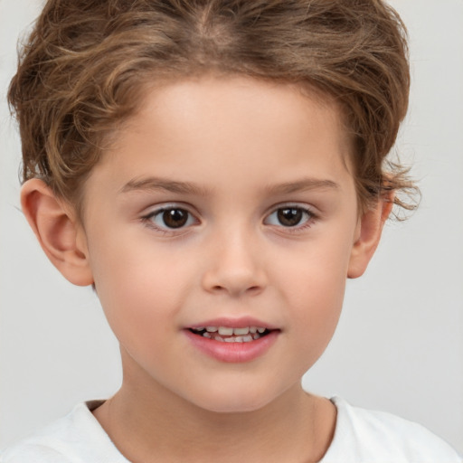 Joyful white child female with short  brown hair and brown eyes