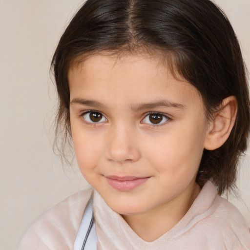 Joyful white child female with medium  brown hair and brown eyes