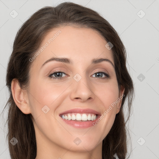 Joyful white young-adult female with long  brown hair and grey eyes