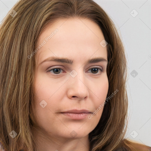 Neutral white young-adult female with long  brown hair and brown eyes