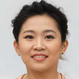 Joyful asian young-adult female with short  brown hair and brown eyes