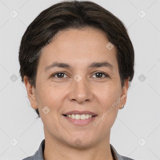 Joyful white adult female with short  brown hair and brown eyes