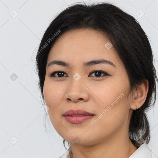 Joyful asian young-adult female with medium  brown hair and brown eyes