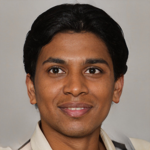 Joyful latino young-adult male with short  black hair and brown eyes
