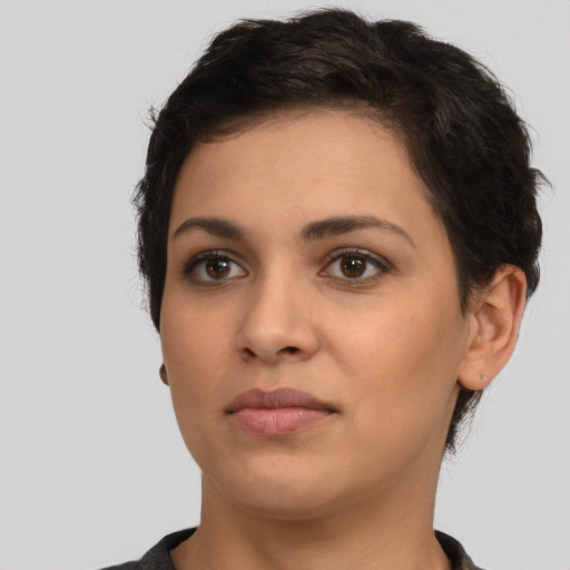 Neutral latino young-adult female with short  brown hair and brown eyes